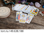 Fortune telling on tarot cards, used Marseille Tarot deck by unknown artist published first in 1709. Fortune telling on tarot cards. Стоковое фото, агентство Ingram Publishing / Фотобанк Лори