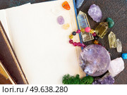 Empty book with copy space with gemstones set for relax and meditation. Magic ball and minerals for Reiki life balance, healing Crystal Ritual, Witchcraft, spiritual esoteric practice.. Healing crystals concept. Стоковое фото, агентство Ingram Publishing / Фотобанк Лори