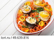 Minced fish appetizer. Banquet food, Fish roll on carrot pillow. Tasty fish rolls, fish appetizer. Стоковое фото, агентство Ingram Publishing / Фотобанк Лори