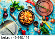 Gravy with meat,mushrooms,zucchini and potatoes.Stew meat in stewpan. Ragout with meat and vegetables. Стоковое фото, агентство Ingram Publishing / Фотобанк Лори
