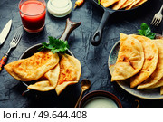 Chebureks making yeast dough, stuffing with minced beef. Delicious appetizing, chebureks. Стоковое фото, агентство Ingram Publishing / Фотобанк Лори