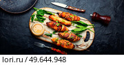 Roasted chicken meat. Chicken breast on a skewer. Meat kebab or shashlik with peanut sauce.. Chicken breast skewers, chicken satay. Стоковое фото, агентство Ingram Publishing / Фотобанк Лори