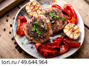 Beefsteak, beef and pork marinated in juniper berries.. Fried beefsteak in bacon. Стоковое фото, агентство Ingram Publishing / Фотобанк Лори