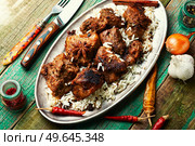 Spicy vindaloo meat with rice. Pork cooked in spicy garlic sauce. Vindaloo, meat in roast spices. Стоковое фото, агентство Ingram Publishing / Фотобанк Лори