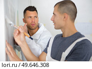 a male painter with apprentice. Стоковое фото, агентство Ingram Publishing / Фотобанк Лори