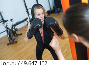 a beautiful kickboxing woman training. Стоковое фото, агентство Ingram Publishing / Фотобанк Лори