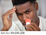 young black man suffering from sinusitis. Стоковое фото, агентство Ingram Publishing / Фотобанк Лори