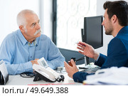 businessman in consultation with elderly client. Стоковое фото, агентство Ingram Publishing / Фотобанк Лори
