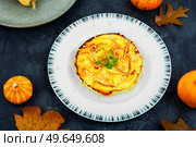 Homemade cakes, autumn recipe. Cottage cheese pumpkin casserole decorated with orange peels.. Homemade cottage cheese and pumpkin casserole. Стоковое фото, агентство Ingram Publishing / Фотобанк Лори
