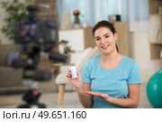 fitness blogger woman recording video for her vblog. Стоковое фото, агентство Ingram Publishing / Фотобанк Лори