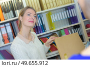 young attractive female librarian. Стоковое фото, агентство Ingram Publishing / Фотобанк Лори