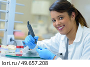 portrait of female dental technician working on prosthetics. Стоковое фото, агентство Ingram Publishing / Фотобанк Лори