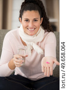 woman sick with pills water. Стоковое фото, агентство Ingram Publishing / Фотобанк Лори