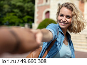lady pulling friend to visit architectural building. Стоковое фото, агентство Ingram Publishing / Фотобанк Лори