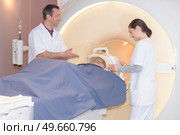 doctor assisting the mri scan with the technician. Стоковое фото, агентство Ingram Publishing / Фотобанк Лори
