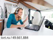 woman using skype in a camping car. Стоковое фото, агентство Ingram Publishing / Фотобанк Лори