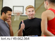 picture of basketball players and coach. Стоковое фото, агентство Ingram Publishing / Фотобанк Лори