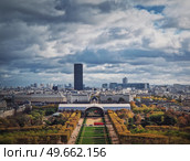 Scenery view from the Eiffel tower height to the Paris cityscape, France. Montparnasse tower and Les Invalides seen on the horizon. Стоковое фото, агентство Ingram Publishing / Фотобанк Лори