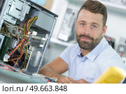 professional man repairing and assembling a computer desktop. Стоковое фото, агентство Ingram Publishing / Фотобанк Лори