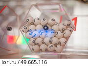 white balls with numbers for the game of lottery. Стоковое фото, агентство Ingram Publishing / Фотобанк Лори