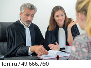 they are questioning the witness. Стоковое фото, агентство Ingram Publishing / Фотобанк Лори