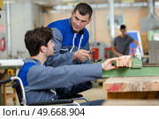 handicapped apprentice at woodworking industry. Стоковое фото, агентство Ingram Publishing / Фотобанк Лори