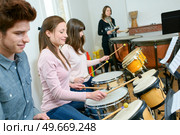 young people during percussion lesson. Стоковое фото, агентство Ingram Publishing / Фотобанк Лори