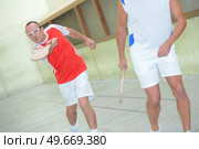 team of men playing basque pelota. Стоковое фото, агентство Ingram Publishing / Фотобанк Лори