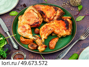 Spicy barbecue chicken legs. Fried chicken thighs. homemade food. Fried chicken drumstick on a plate. Стоковое фото, агентство Ingram Publishing / Фотобанк Лори