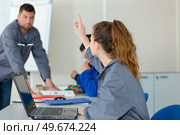 young woman in auto mechanics training class. Стоковое фото, агентство Ingram Publishing / Фотобанк Лори
