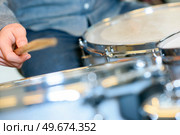 close up of a playing the drums. Стоковое фото, агентство Ingram Publishing / Фотобанк Лори