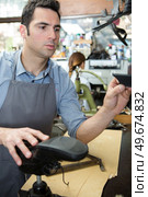 a man fixing the shoes. Стоковое фото, агентство Ingram Publishing / Фотобанк Лори