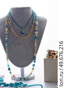 author set with different blue colors  necklaces  presented on maneken against white background. jewelry and hobby concept. trends2023. Стоковое фото, агентство Ingram Publishing / Фотобанк Лори