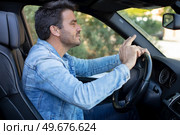 the upset driver man in the car discontent. Стоковое фото, агентство Ingram Publishing / Фотобанк Лори