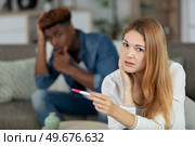 upset couple finding out results of a pregnancy test. Стоковое фото, агентство Ingram Publishing / Фотобанк Лори