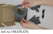 Female hands pull out Russian black letters from a box. Стоковое видео, видеограф Катерина Белякина / Фотобанк Лори