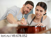 man and woman working as lute maker. Стоковое фото, агентство Ingram Publishing / Фотобанк Лори