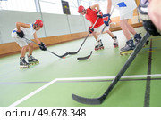 men playing a hockey game. Стоковое фото, агентство Ingram Publishing / Фотобанк Лори