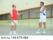 portrait of men playing pala. Стоковое фото, агентство Ingram Publishing / Фотобанк Лори