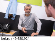 mature student in the locker room at college. Стоковое фото, агентство Ingram Publishing / Фотобанк Лори