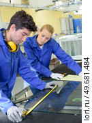 young qualified people forced to work at the factory. Стоковое фото, агентство Ingram Publishing / Фотобанк Лори
