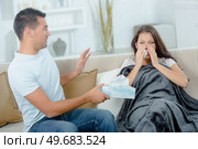 woman with colds covering her noise with a tissue. Стоковое фото, агентство Ingram Publishing / Фотобанк Лори