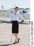 a stewardess on the airfield. Стоковое фото, агентство Ingram Publishing / Фотобанк Лори