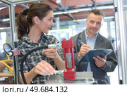 woman worker and manager checkin quality. Стоковое фото, агентство Ingram Publishing / Фотобанк Лори