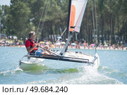 enjoying extreme sailing with racing sailboat. Стоковое фото, агентство Ingram Publishing / Фотобанк Лори