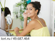 woman with cotton pad removing makeup. Стоковое фото, агентство Ingram Publishing / Фотобанк Лори