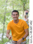 man on the roping park. Стоковое фото, агентство Ingram Publishing / Фотобанк Лори