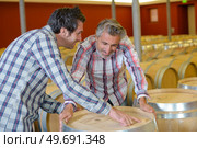 two men in the cooperage. Стоковое фото, агентство Ingram Publishing / Фотобанк Лори