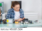 portrait of female electronic assembler. Стоковое фото, агентство Ingram Publishing / Фотобанк Лори