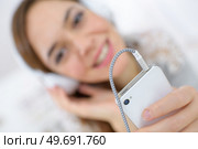 a woman is enjoying music. Стоковое фото, агентство Ingram Publishing / Фотобанк Лори